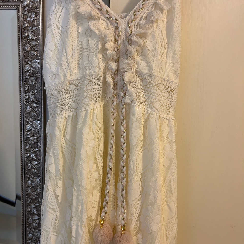 I am selling a boho dress that is very Coachella. In cream and lace